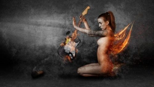 Featured Image Of A Seated Fiery Angel Holding A Fiery Guitar.