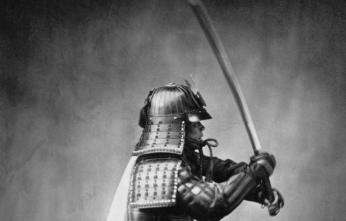 Image Of A Japanese Samurai Armored With Sword Raised.