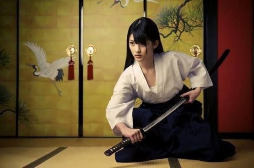Featured Image Of A Female Japanese Warrior Drawing Out Her Sword.