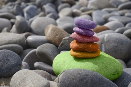 photocredit/thanks:pixabay Image Of Beach Stones With Several Colored Arranged In A Zen Type Pile.