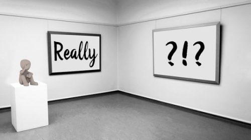 Man On Pedestal Ponders Questions On Wall Boards.