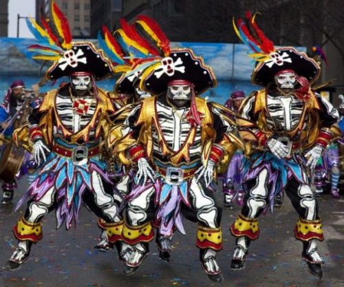 Image Of A Trio Of Dancers Wearing Elaborate Colorful Pirate Costumes.