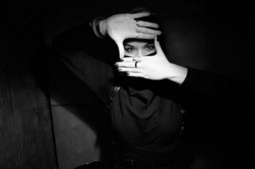 Featured Image Of A Female Kunoichi Ninja Peeking Through Her Hands.