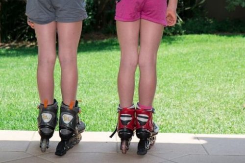 photocredit/thanks:Steve Buissinne:pixabay Pair Of Children Wearing Rollerskates Looking Over A Grassy Area.