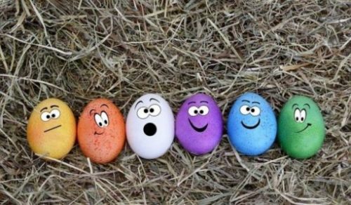 photocredit/thanks:annca:pixabay Featured Topic Image Lying On A Straw Bed, A Row Of 6 Different Colored Eggs With Facial Features Of Varied Joyous Expressions.