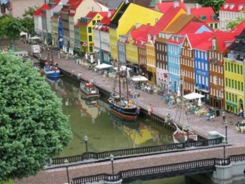 Featured Topic Image Of Legoland In Copenhagen. Highlighting A Bridge And Row Of Multi Colored Houses.