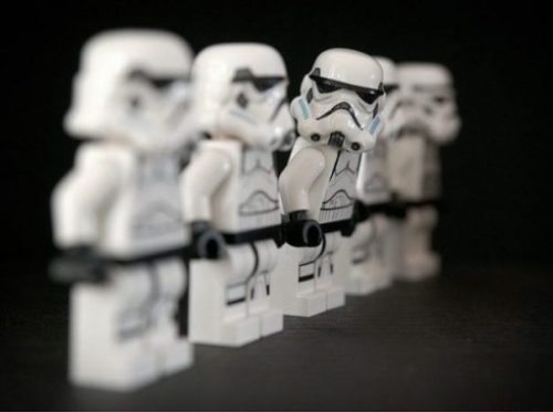 Featured Image Of 5 Lego Stormtrooper Figurines In A Diagonal Row With The Middle Figure Upper Body Turned Towards The Front.