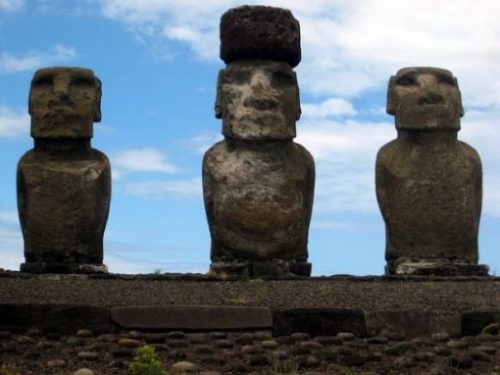 Featured Topic Image Close Up Of Three Easter Island Stone Giant Statues. Middle One Has A Stone Hat.