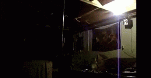 Gif Of A Martial Artist High Kicking Out A Light.
