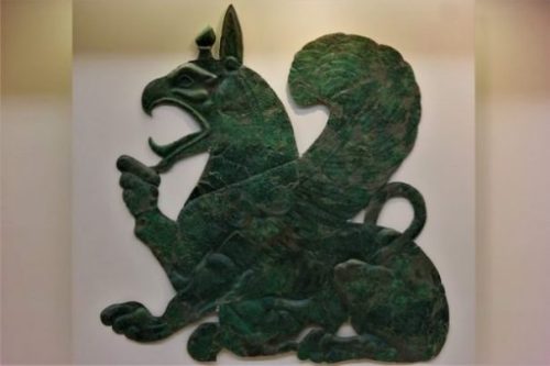Image Of A Green Colored Metal Craft Griffin.
