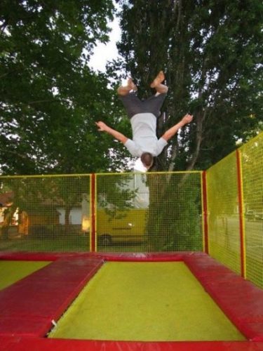 Image Of A Male Trampolinist Heading Down.