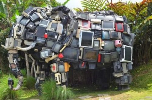 Featured Image Of An Elephant Statue Made Of Many Small Television Sets.