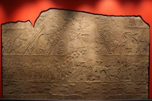 Image Of Yore Sumer Relief Featuring Giant Soldiers Amongst An Army.