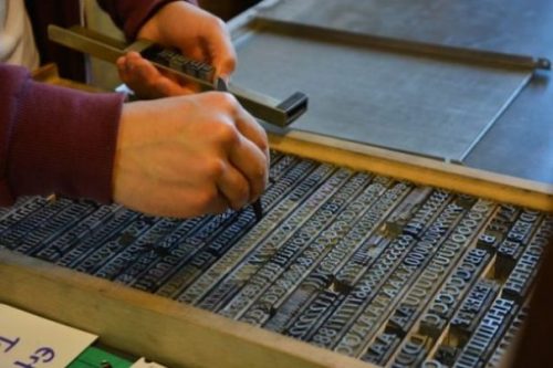 Image Of Printing Typeset Being Arranged.