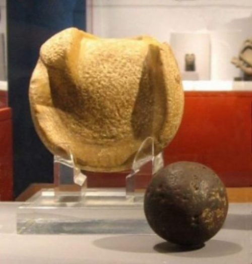Image Of Ancient Mesoamerican Manopla And Rubber Ball.